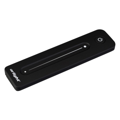 Пульт SMART-R38-DIM (1 зона, 2.4G) (Arlight, IP20 Пластик, 5 лет) Пульт-слайдер 2.4 ГГц черного цвета для управления одноцветными источниками света. 1 зона управления яркостью с помощью сенсорного слайдера. Питание 3VDC (CR2032). Габариты 139x36x11 мм. Изготовлен из пластика с покрытием Soft Touch. Совместим с диммерами, контроллерами и панелями серии SMART (поставляются отдельно).